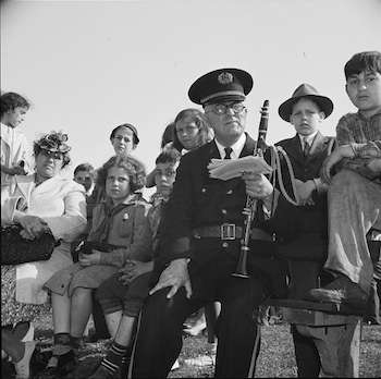 Gloucester, Massachusetts. Memorial Day, 1943. An aged member of the American Legion band resting after the parade.