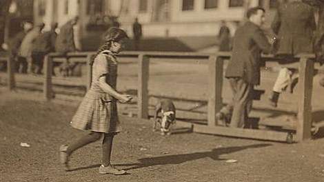Phoebe Thomas, an 8-year-old Syrian girl, at 6 a.m. She was on her way to work cutting sardines at the Seacoast Canning Co.