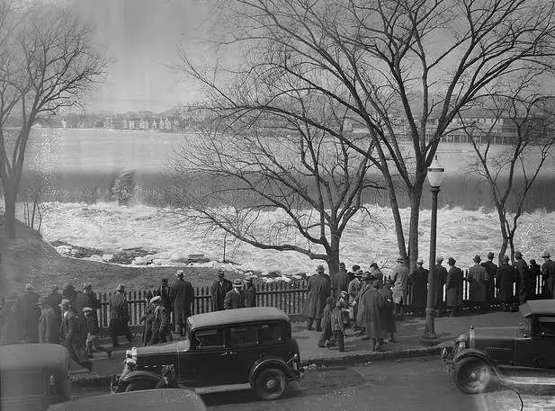 People watching the Merrimack River in Lawrence, Mass. Photo courtesy Boston Public Library, Leslie Jones Collection.