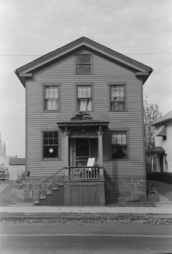 'House with articles on roof of porch during fall house cleaning, Meriden, Conn.' Photo courtesy Library of Congress.