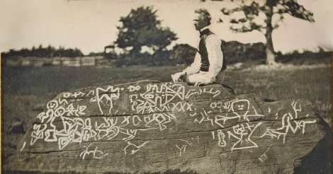 Draftsman, painter, and watercolorist Seth Eastman appears seated atop Dighton Rock, a proper gentleman in high collar and vest contrasted with the natural setting and primitive, cryptic carvings. Eastman had been commissioned to illustrate Henry Rowe Schoolcraft's book, Historical and Statistical Information Respecting the History, Condition and Prospects of the Indian Tribes of the United States. (From the Getty Museum)