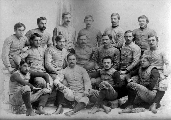 1892 Springfield College Football Team. Naismith and Morgan are in the middle row, Naismith in the center holding the football and Morgan second from the right. Courtesy of Springfield College, Babson Library, Archives and Special Collections.